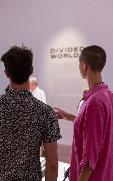 Two people interacting and exploring an exhibition at the Samstag Museum