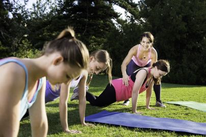 Human Movement alumni instructing a yoga class